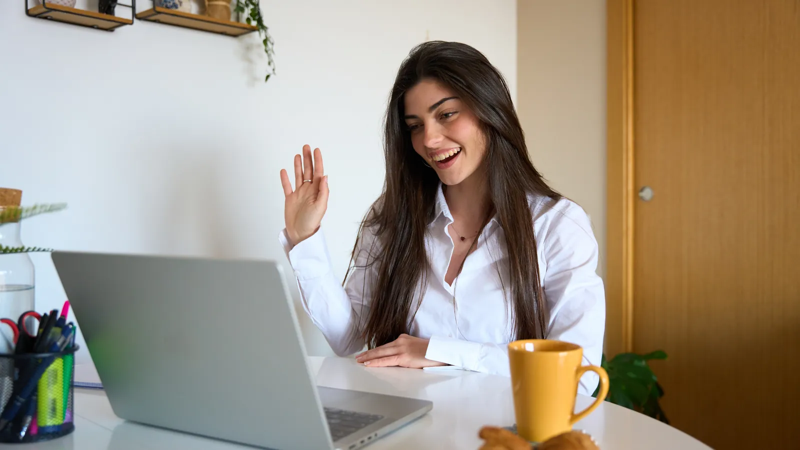 Participant greeting her coach in an online video session
