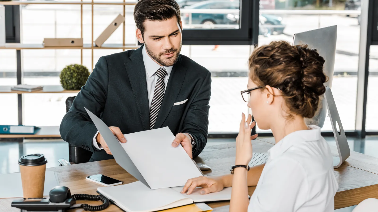 Job applicant discussing her documents with an HR professional